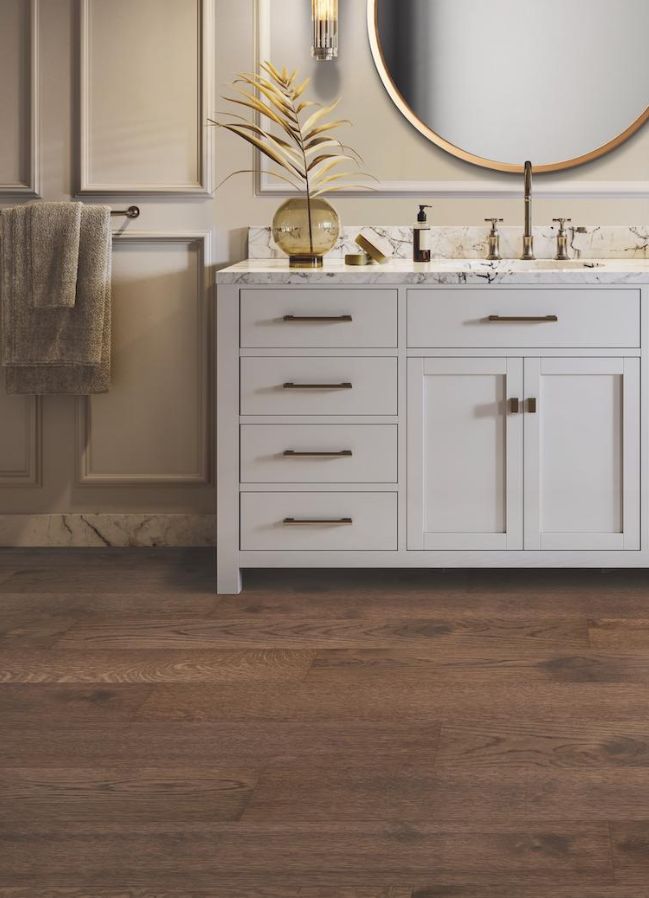 dark stained hardwood floors in an elegant bathroom